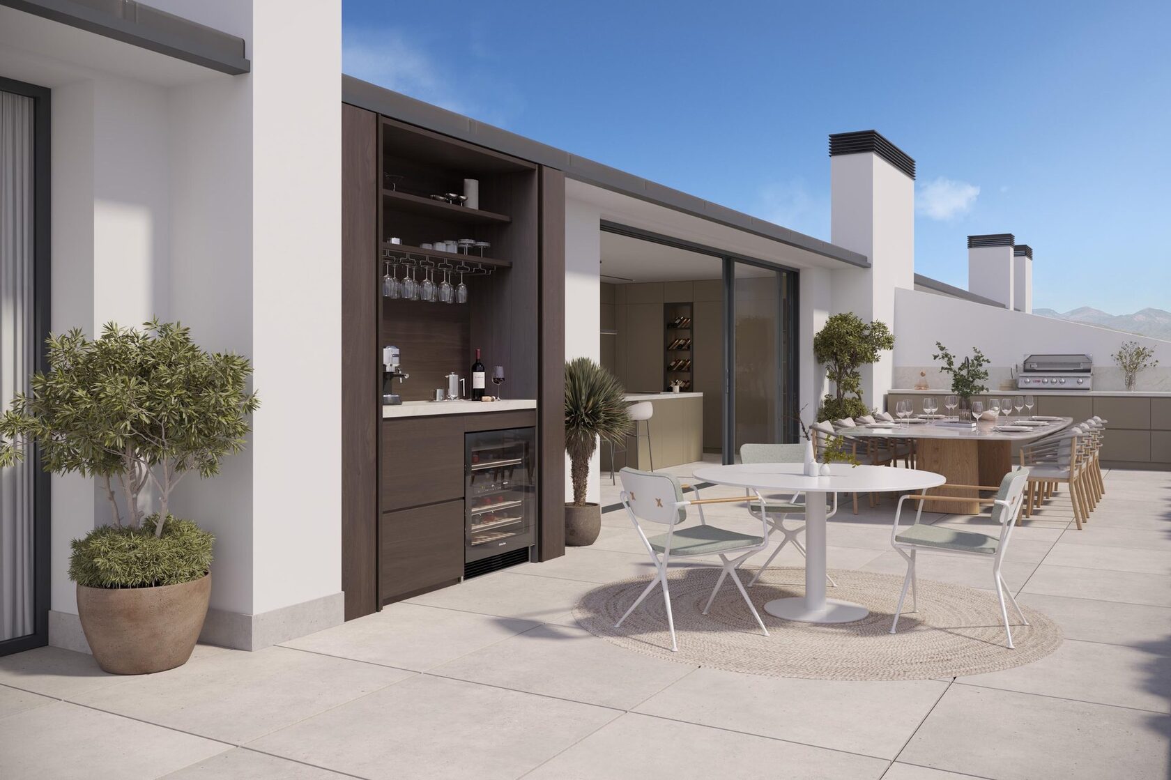 Roof terrace with bar and long dining table