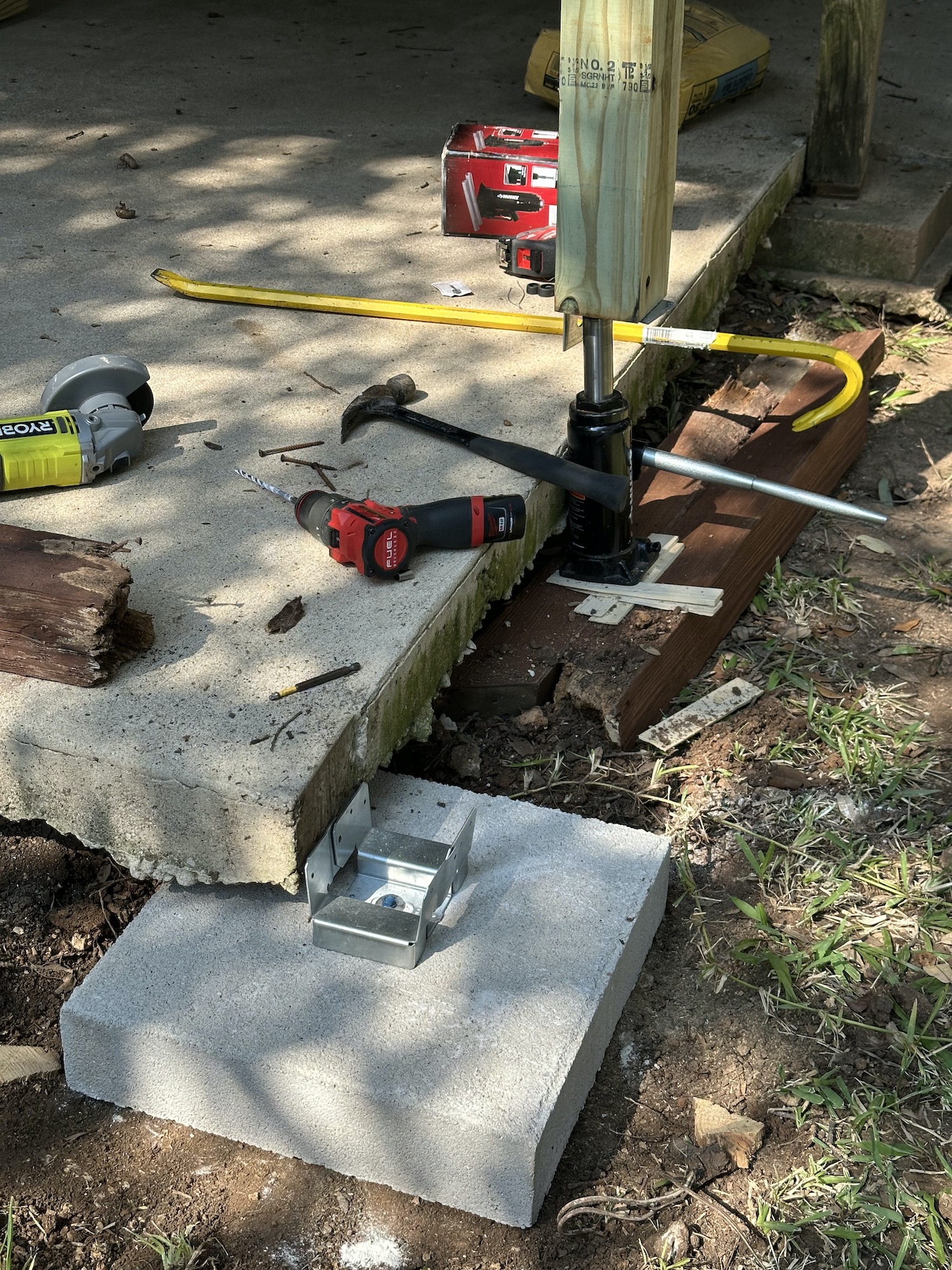 Deck framing reinforced with galvanized structural connectors and brackets