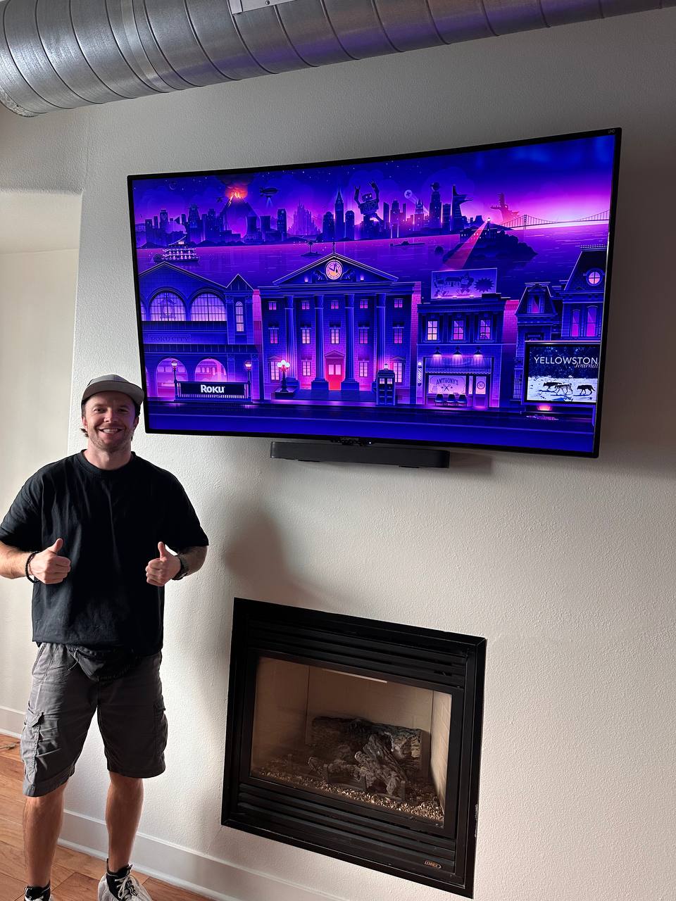 Above the fireplace — soundbar, no wires