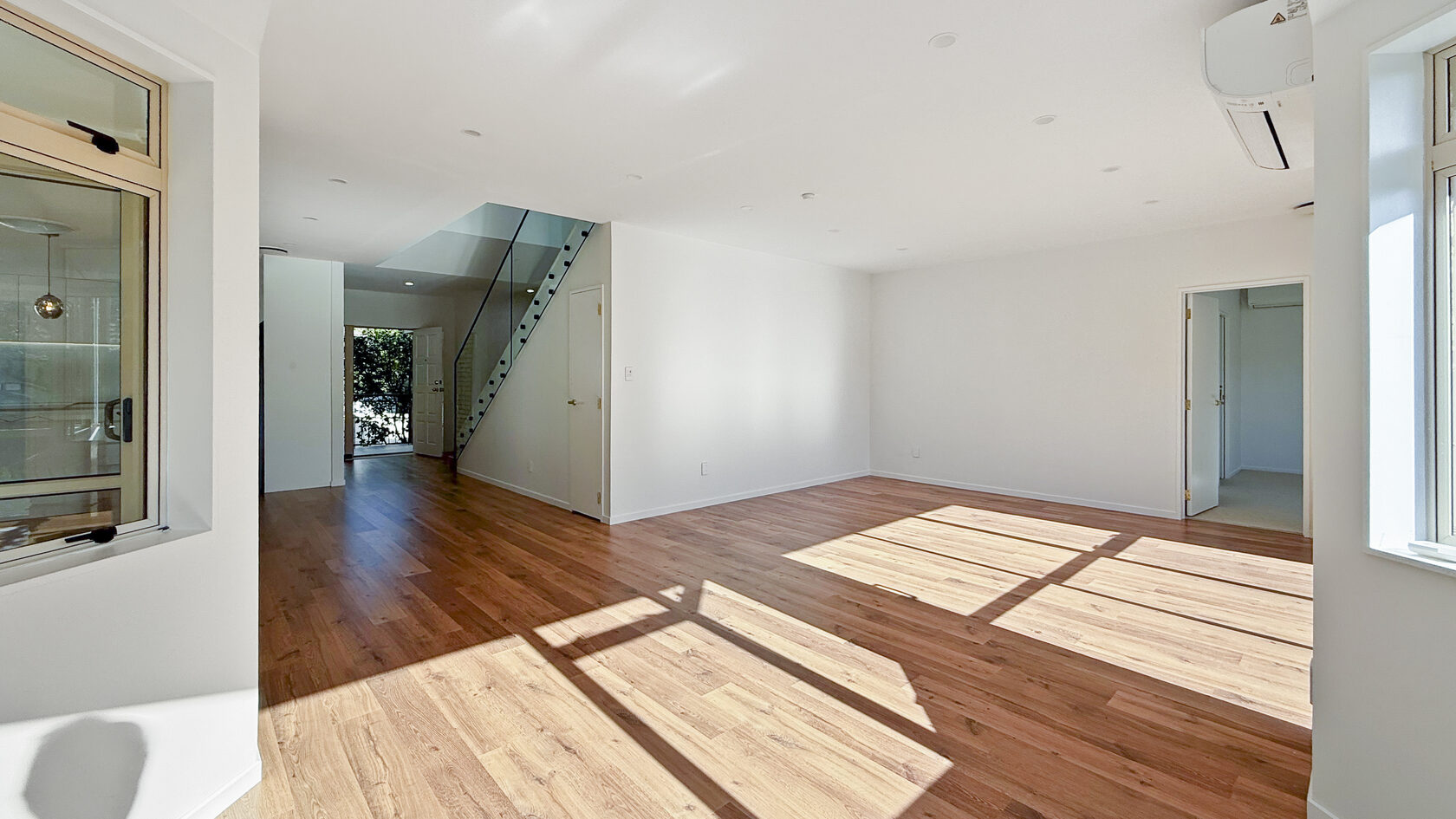 Renovated St Heliers living area with timber floors and natural light.