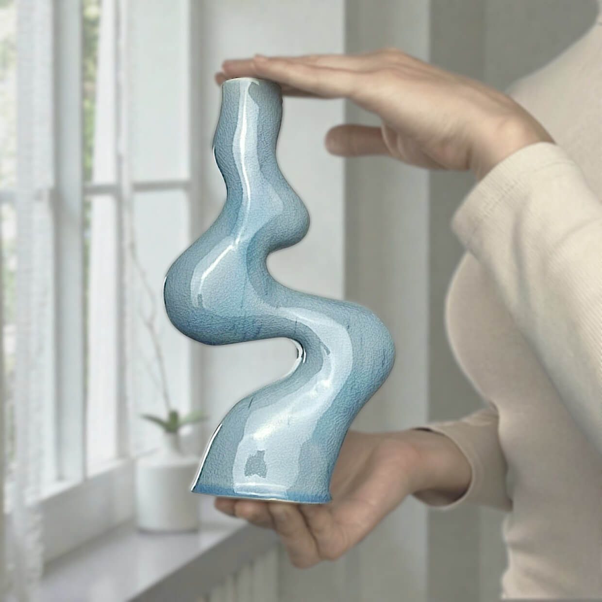 Interior ceramic candle holder with wavy shape, light blue glossy glaze, handcrafted designer piece