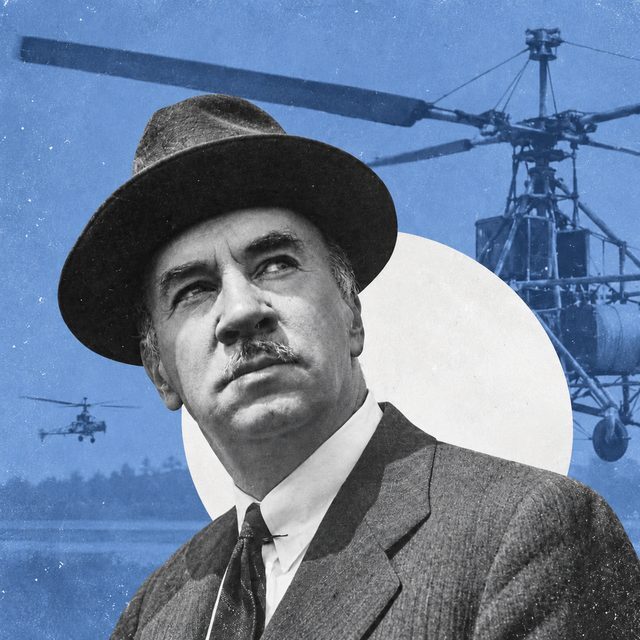 Igor Sikorsky, aviation pioneer, with one of his early helicopters behind him