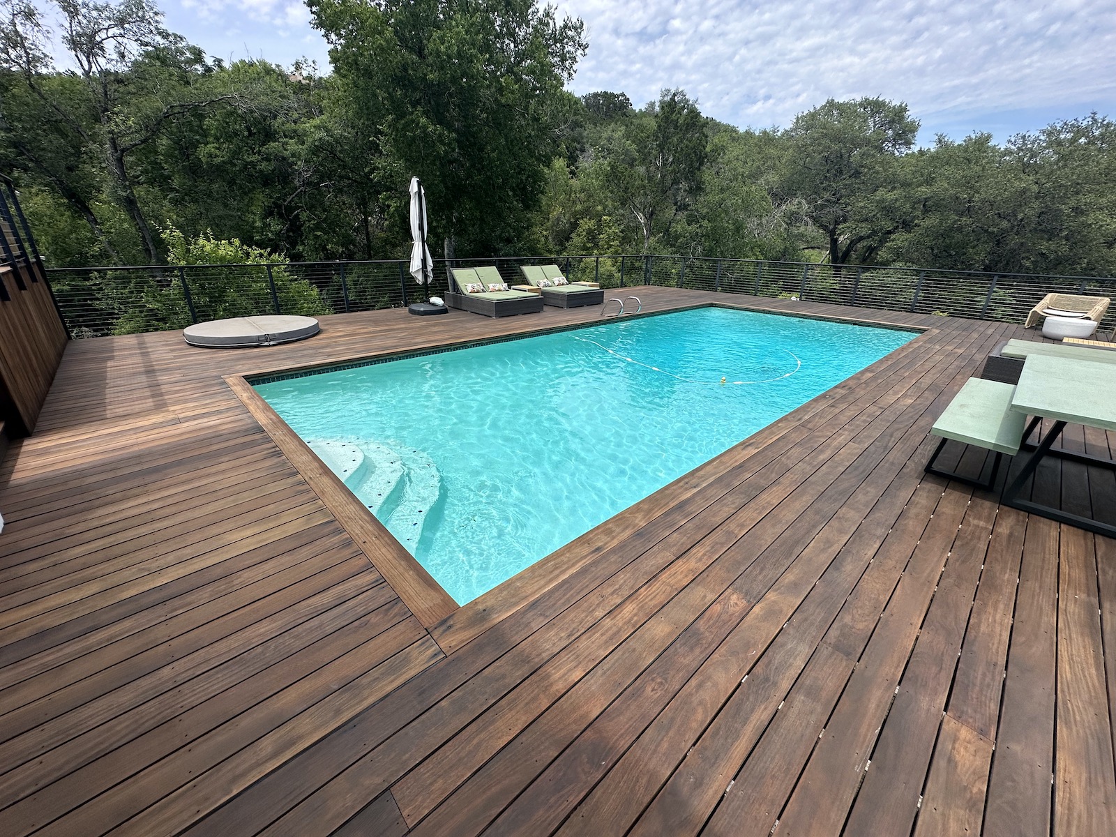 IPE deck restoration West Lake Hills TX — finished hardwood deck after sanding cleaning brightening and oil finish