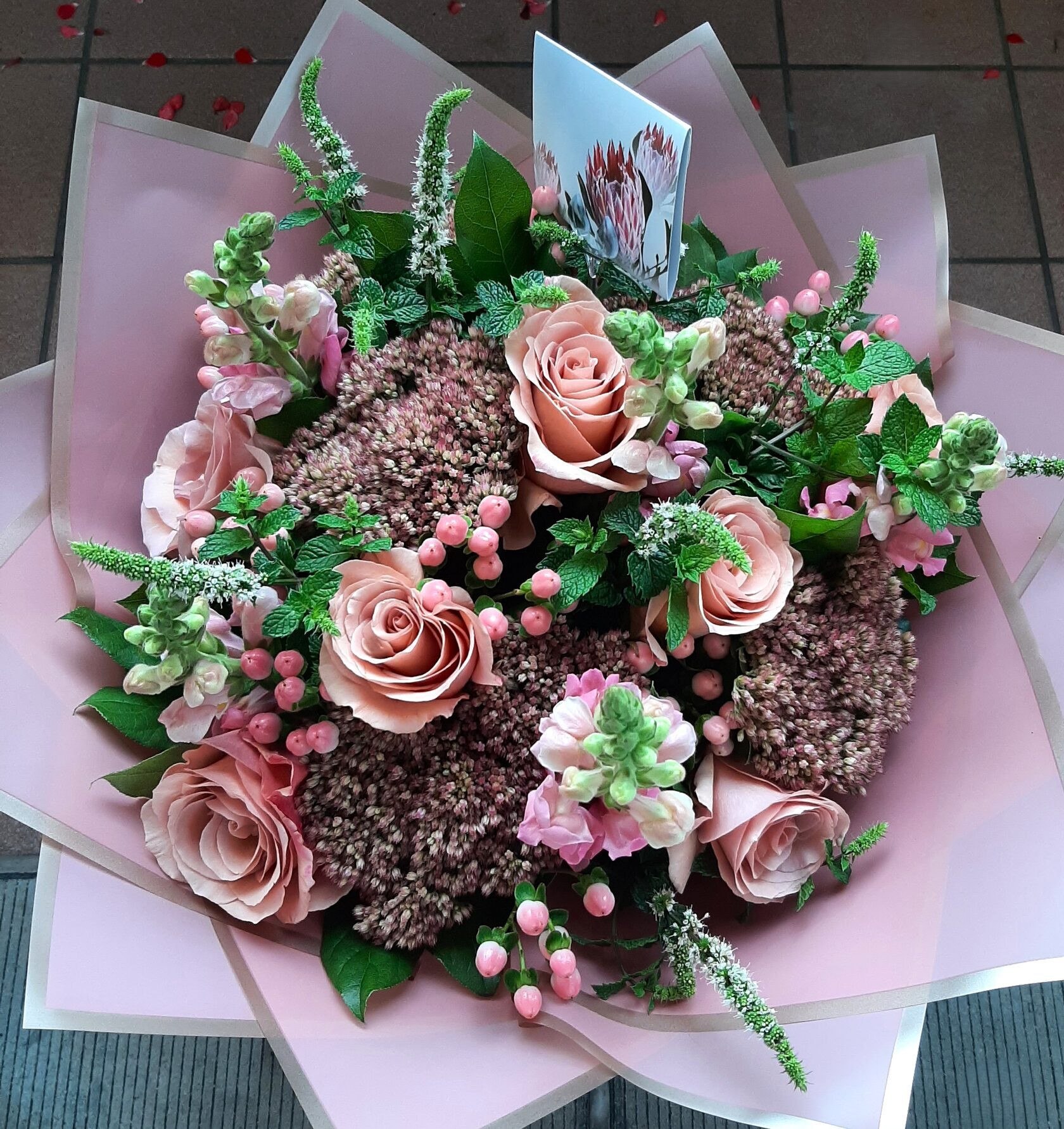 a delicate bouquet in shades of pink and powder