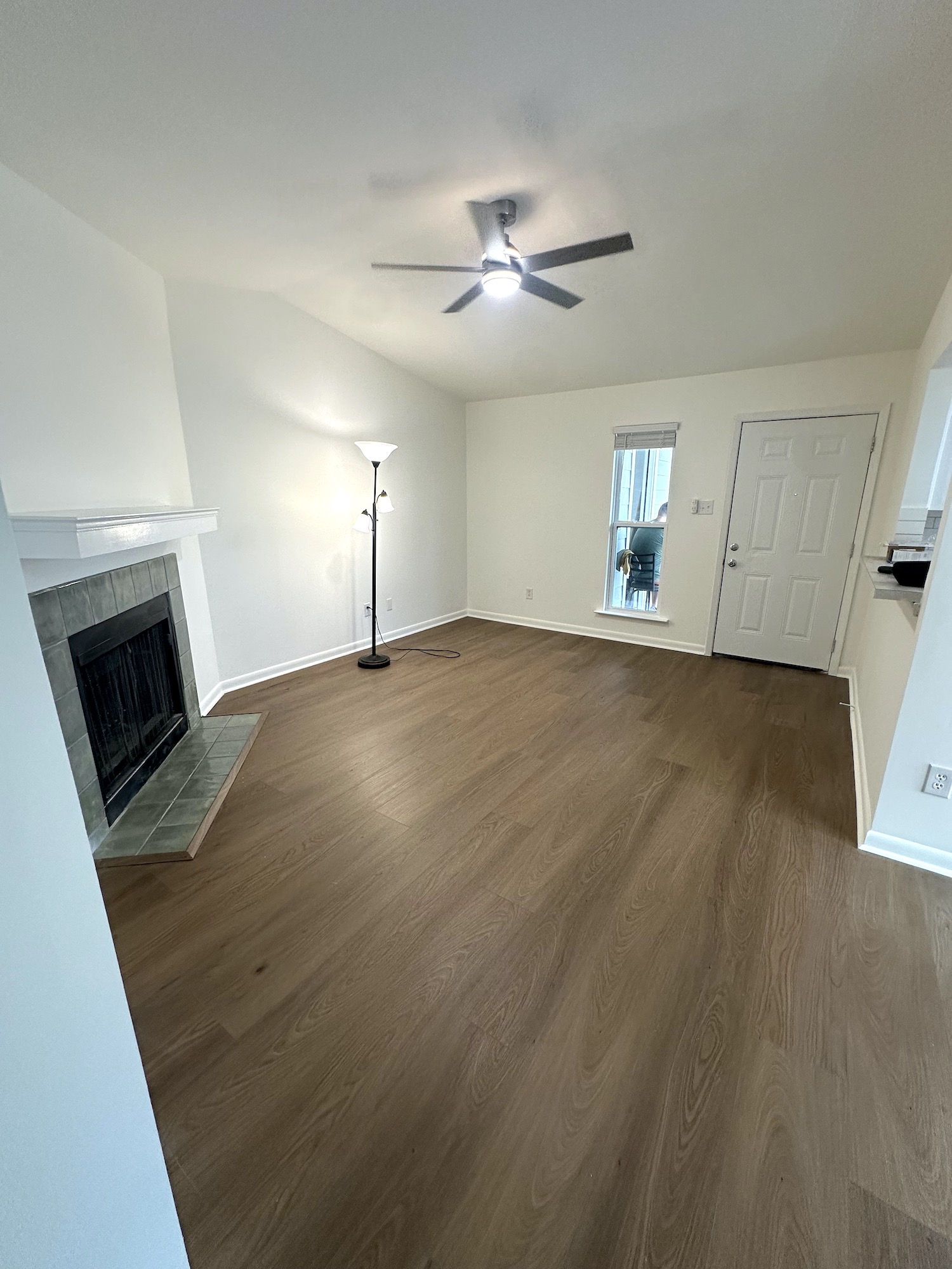 Completed Austin apartment renovation with smooth vaulted ceiling, freshly painted walls, new flooring and updated interior doors