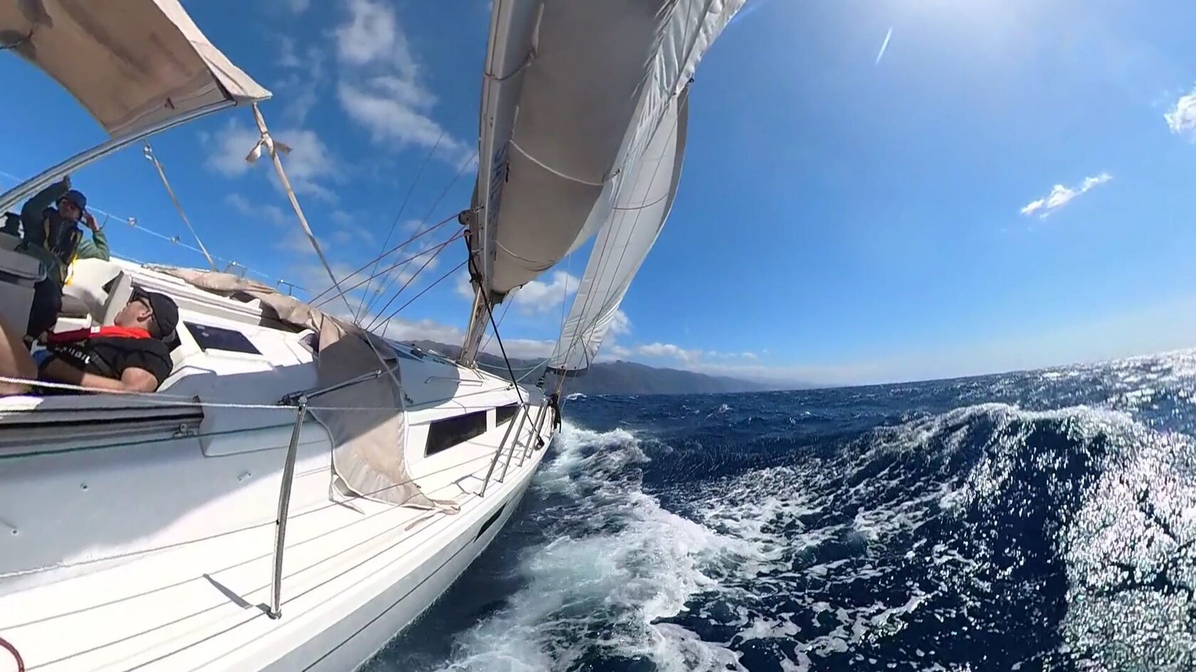 Elmár Sailing yacht heeling under sail with a white wake