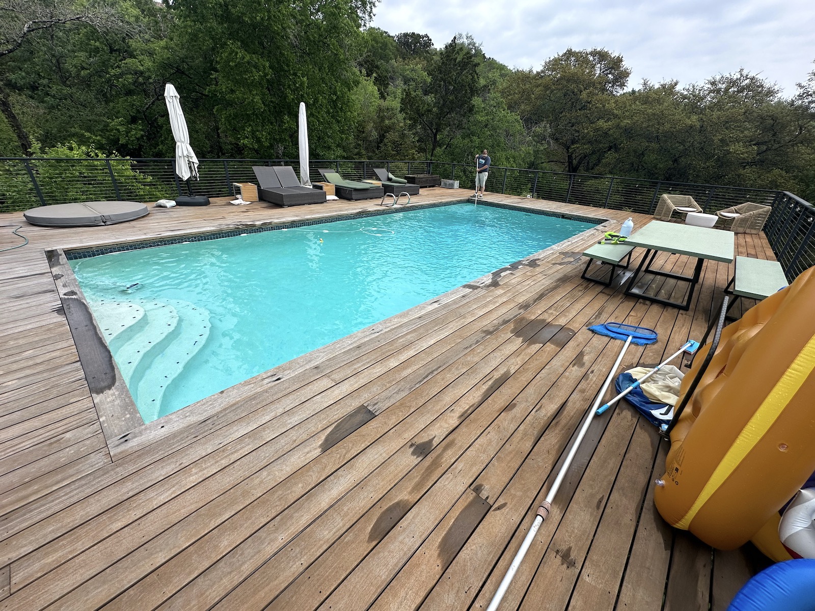 Before IPE deck restoration West Lake Hills TX — gray oxidized hardwood surface