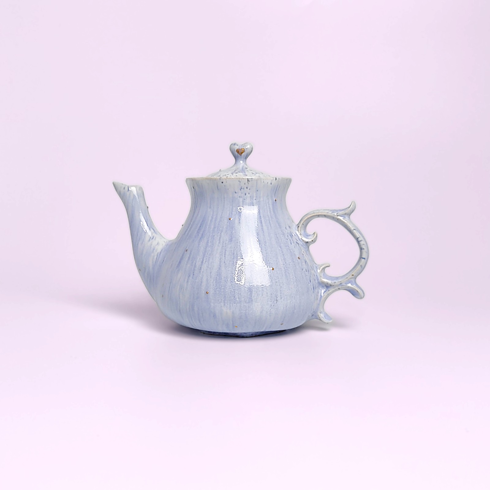 delicate blue handmade tea set — teapot, cups and saucers with carved forest fairy medallions