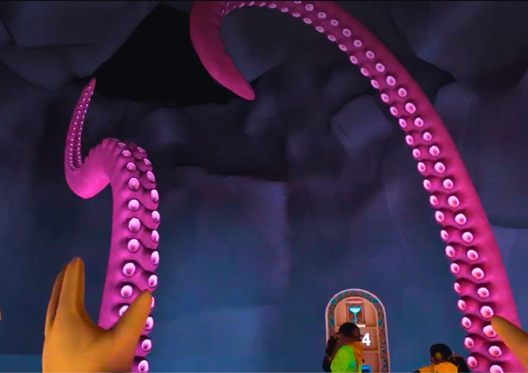 Players facing the giant octopus in VR