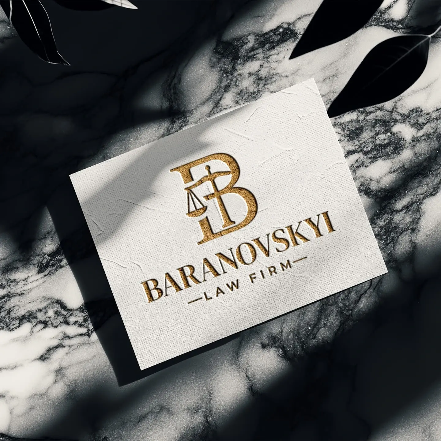 Lawyer business card with the BARANOVSKYI LAW FIRM logo