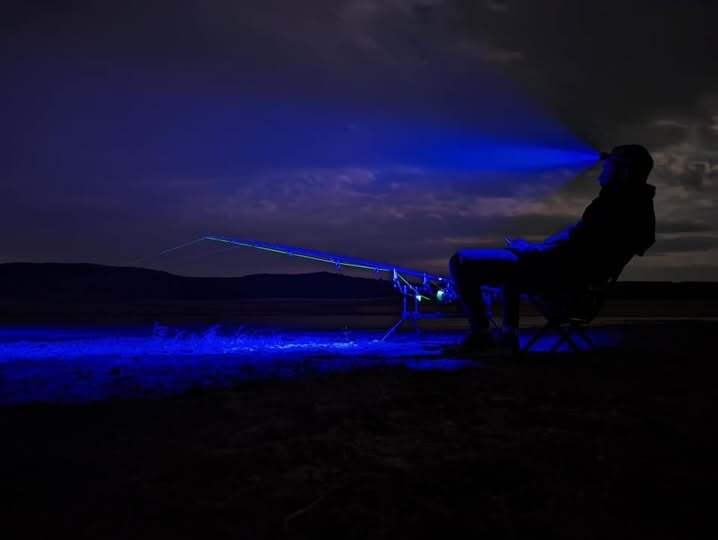 Angler using the Katran W/B 460 PRO headlamp
