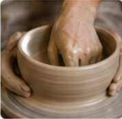 Pulling clay walls on pottery wheel