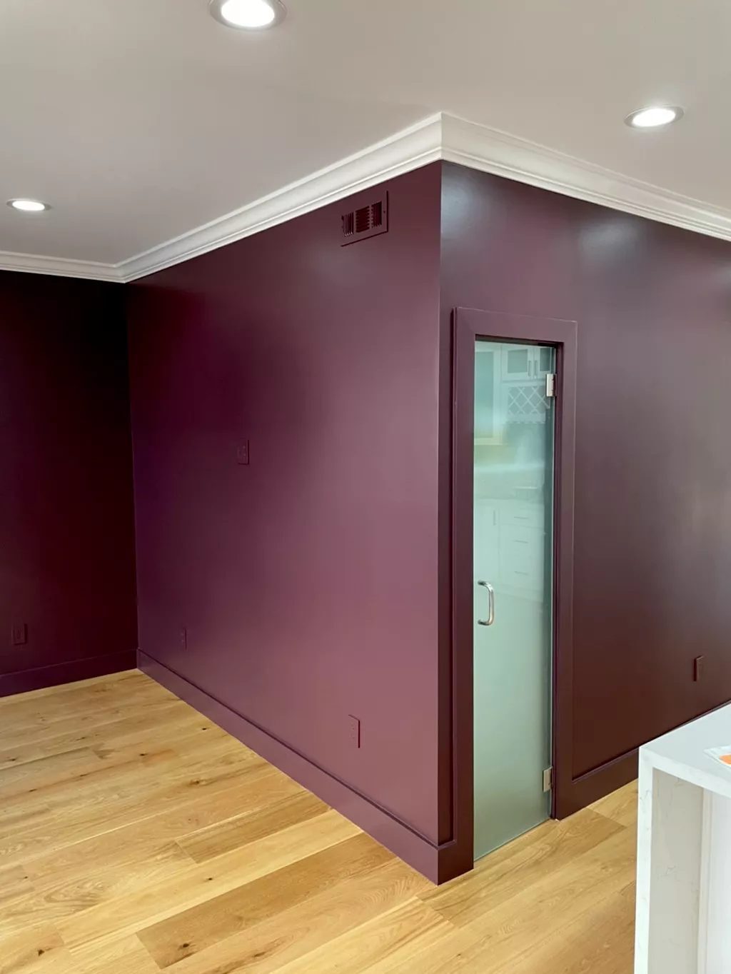 Deep plum accent walls with white crown molding, Miami Shores FL