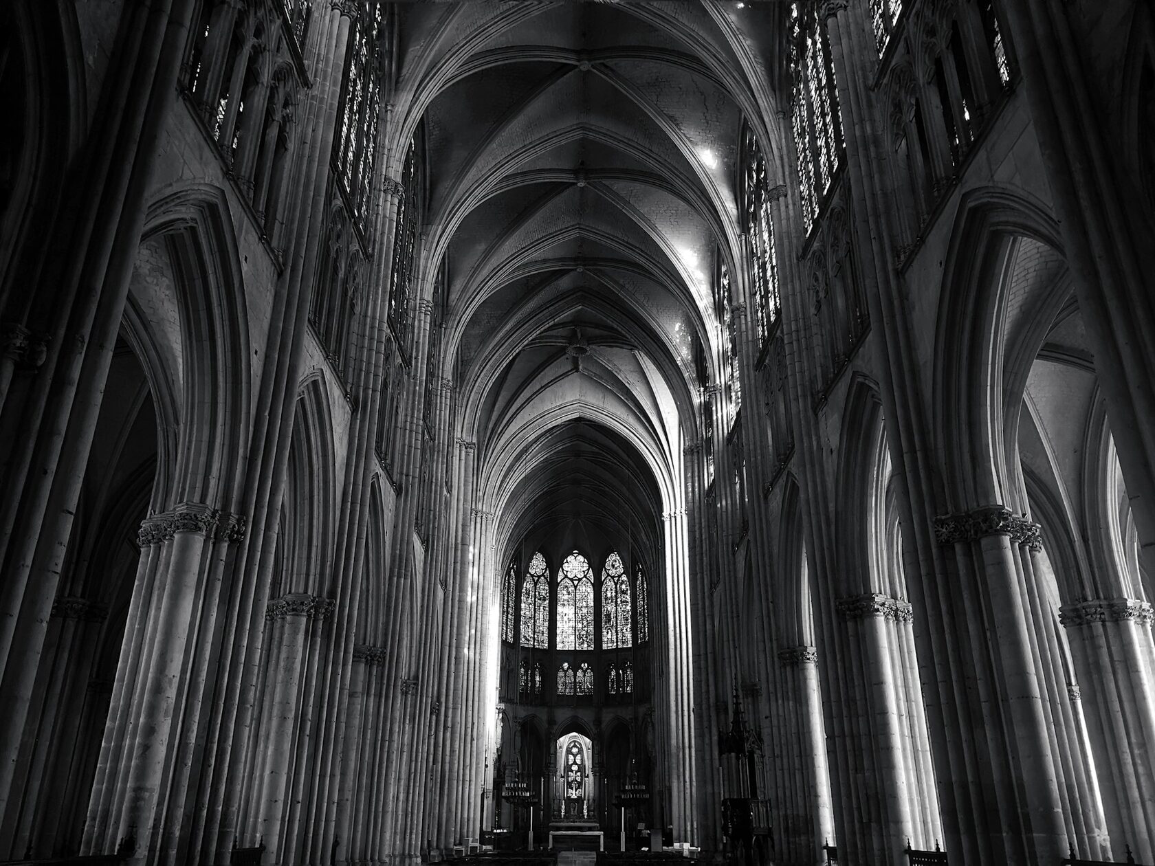 A choir singing beneath the arches of an English cathedral