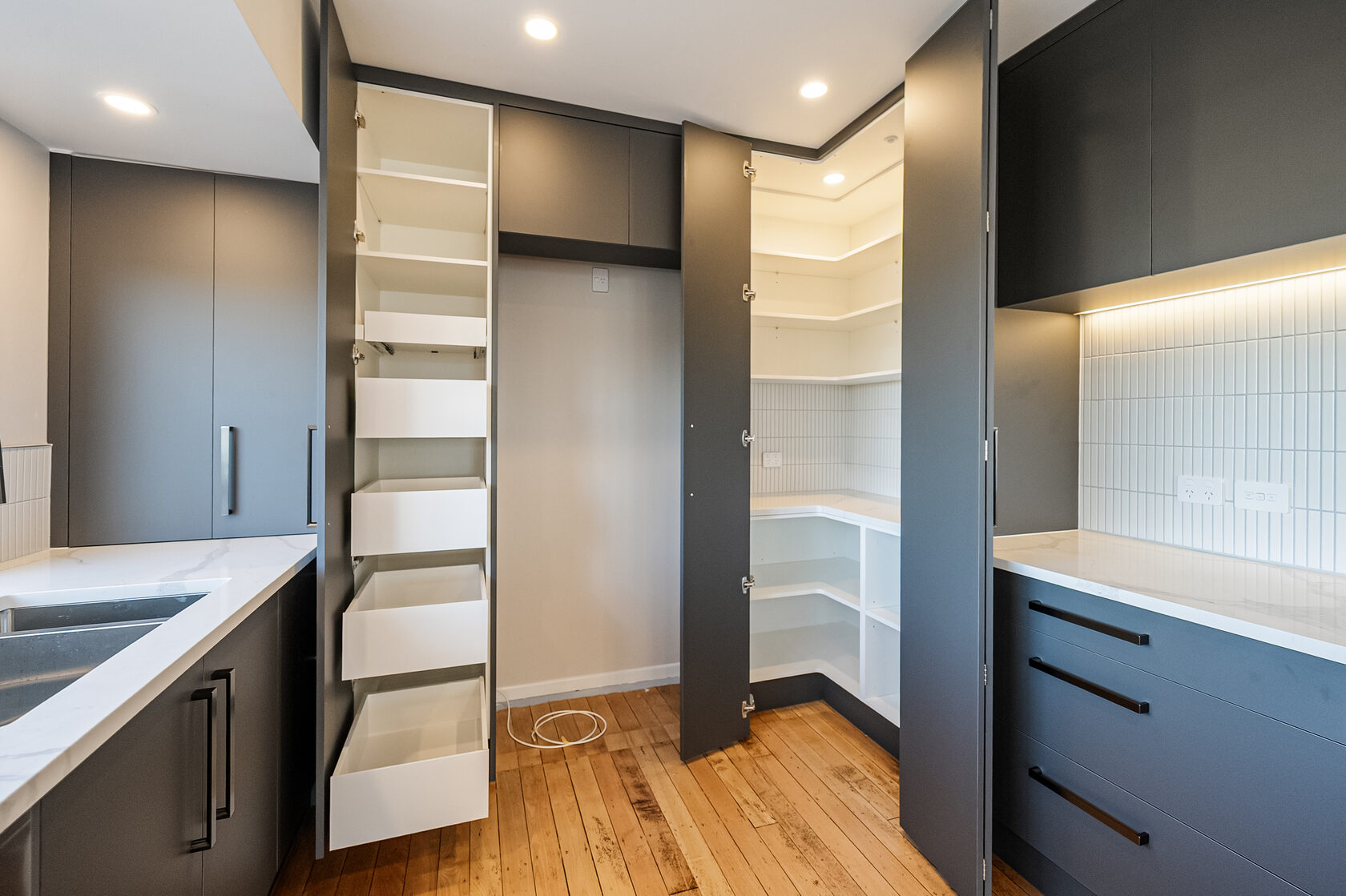 Open integrated storage beside the Glenfield kitchen work area