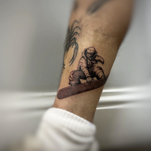 Fine line portrait tattoo on forearm