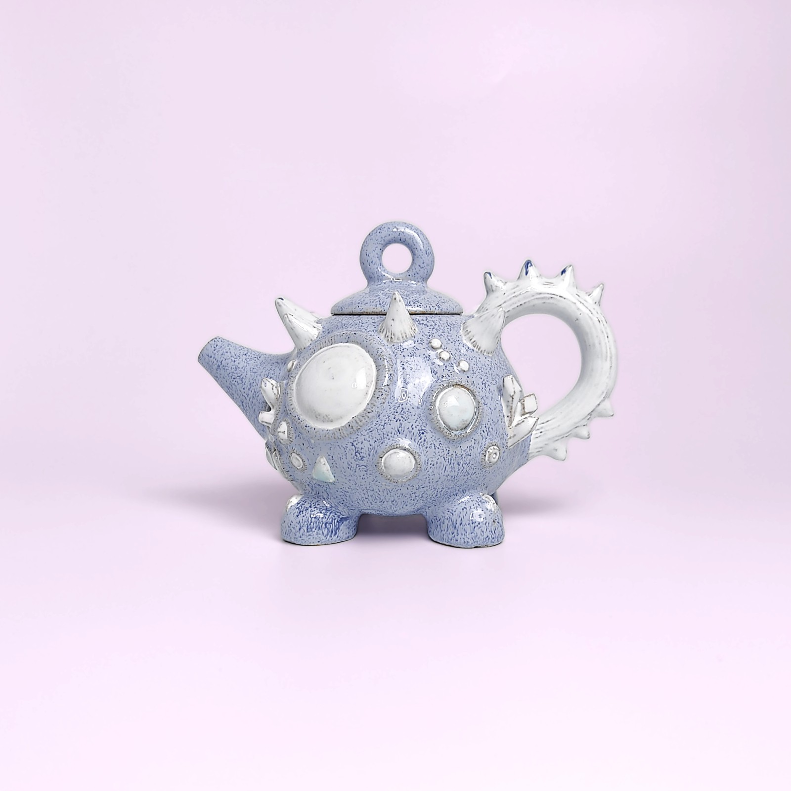 Unique handmade fairy-tale ceramic tea set shaped like a whimsical crystal-covered little monster, featuring a sculptural teapot and two matching cups with saucers