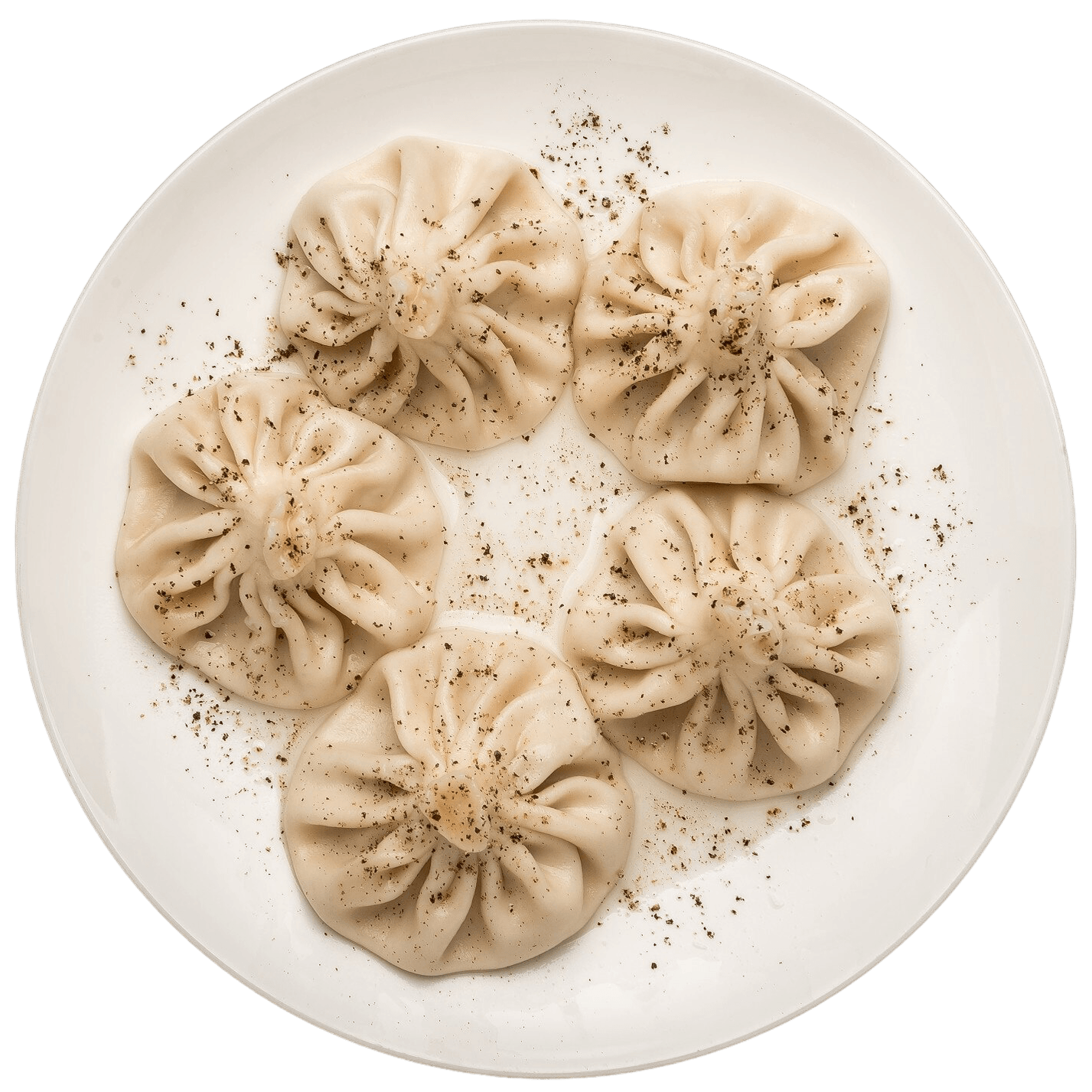 Cooked Georgian khinkali on a white plate ready to share