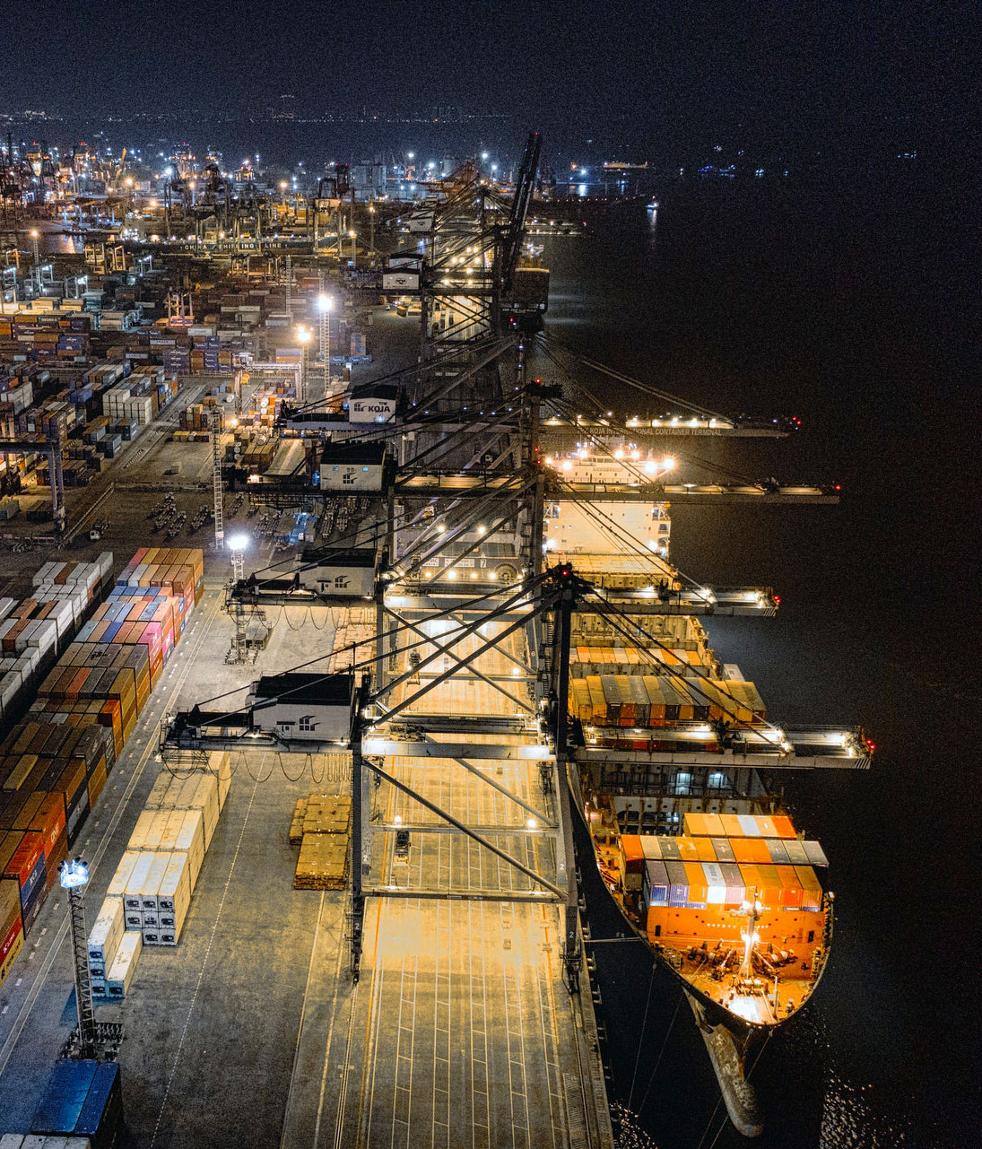 Aerial view of a working port terminal at night
