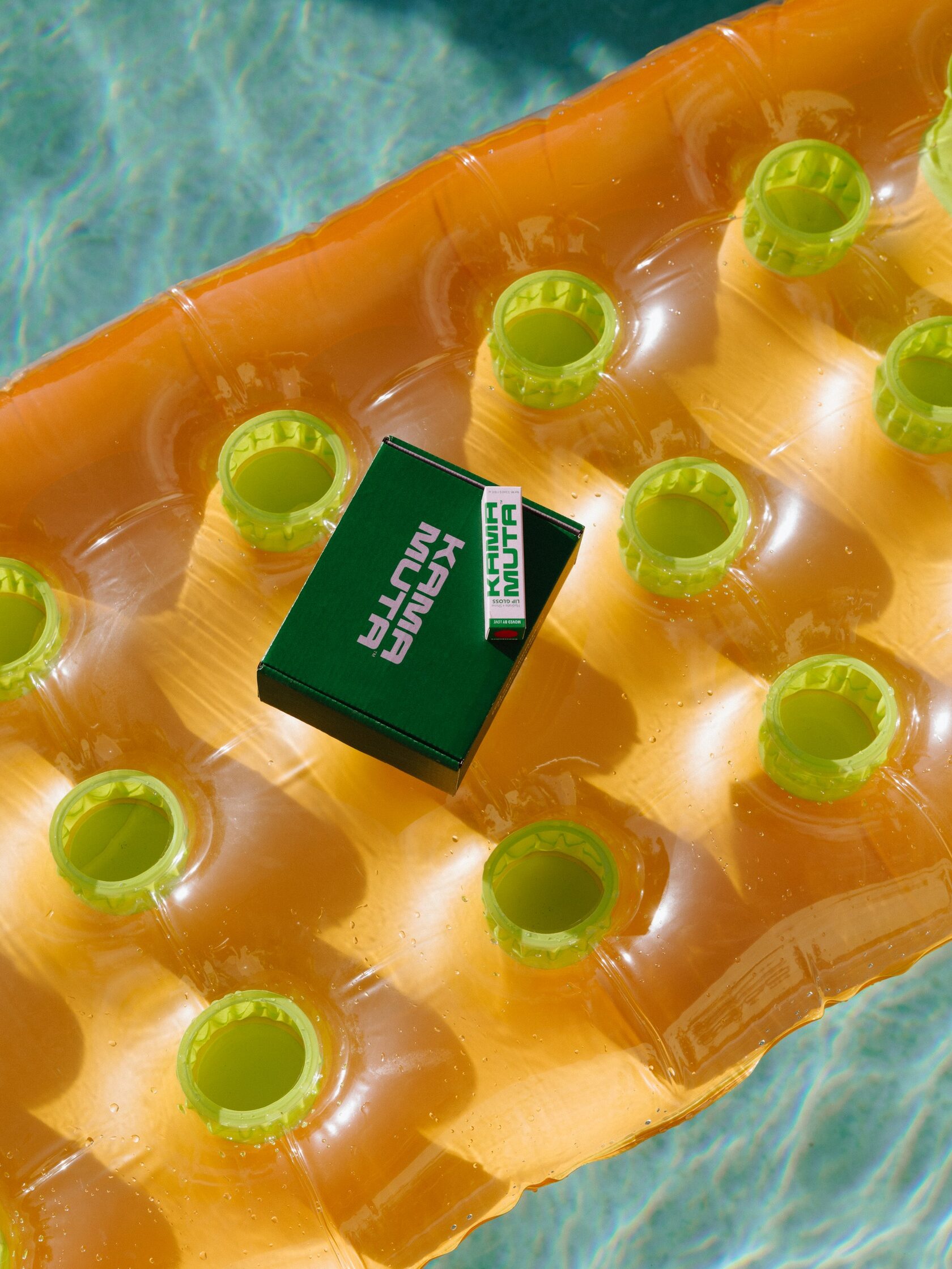 Kama Muta box on a pool float
