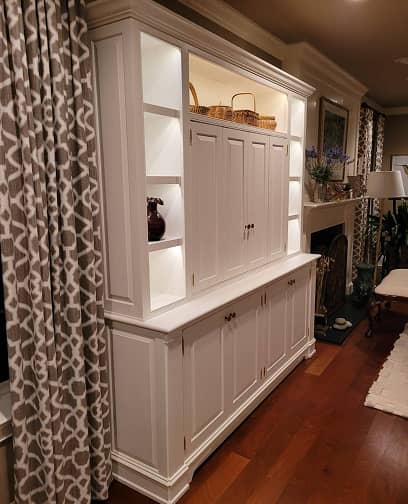 White color classic entertainment and display cabinet with concealed TV and lighted shelves
