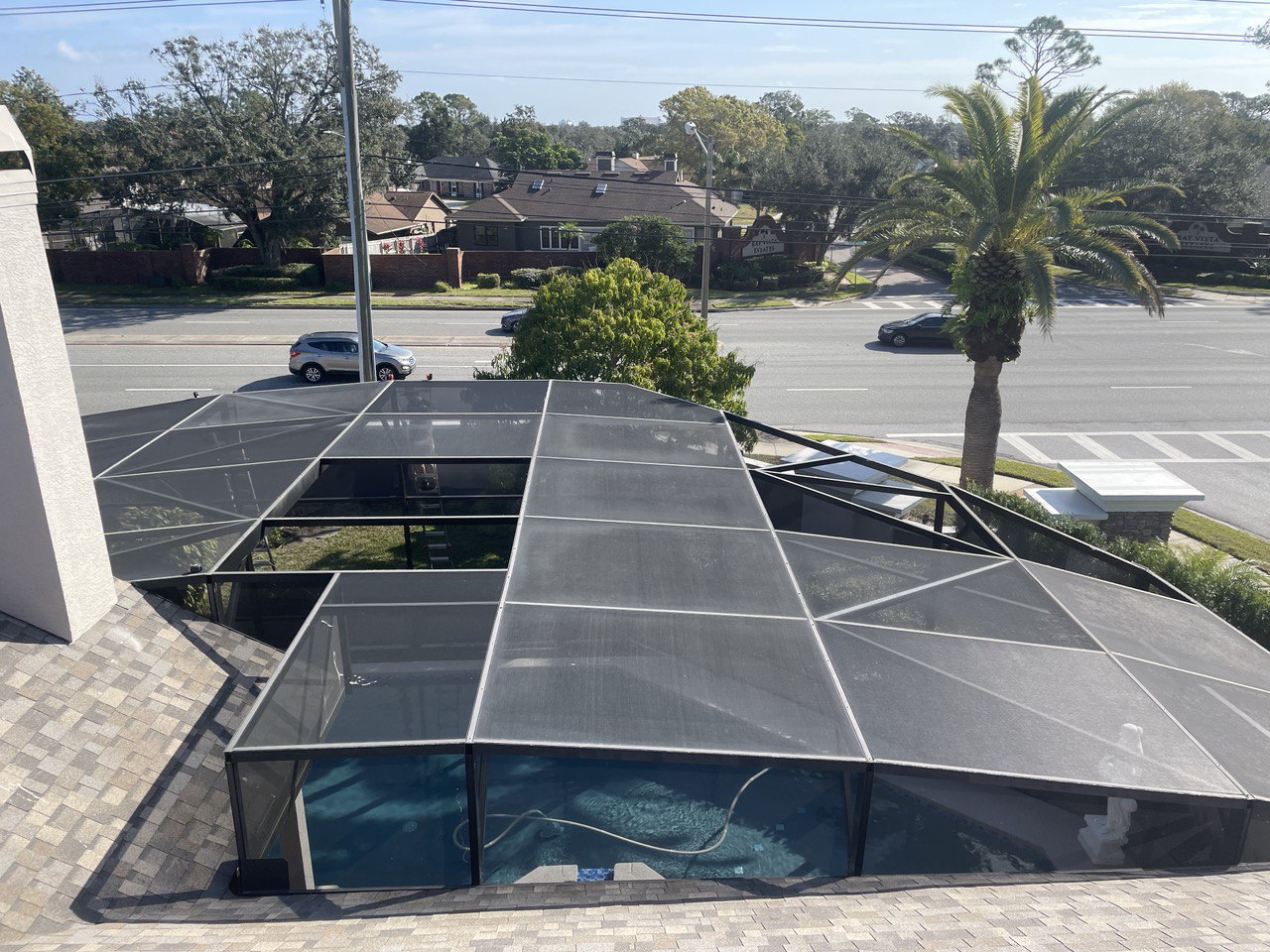Damaged pool screen panel before repair