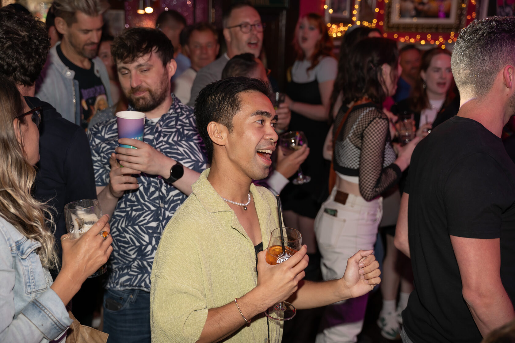 Crowd enjoying a lively indoor party