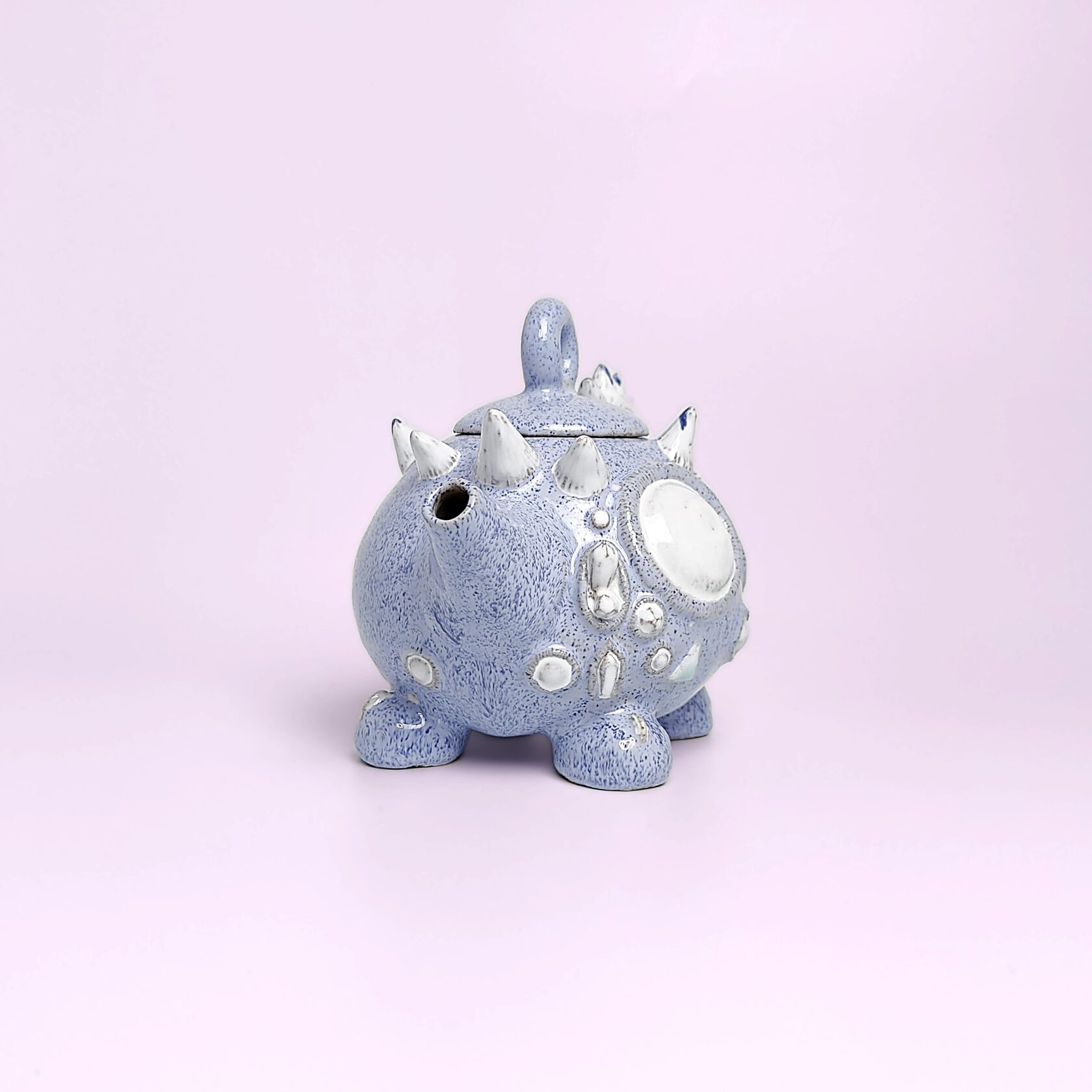 Unique handmade fairy-tale ceramic tea set shaped like a whimsical crystal-covered little monster, featuring a sculptural teapot and two matching cups with saucers
