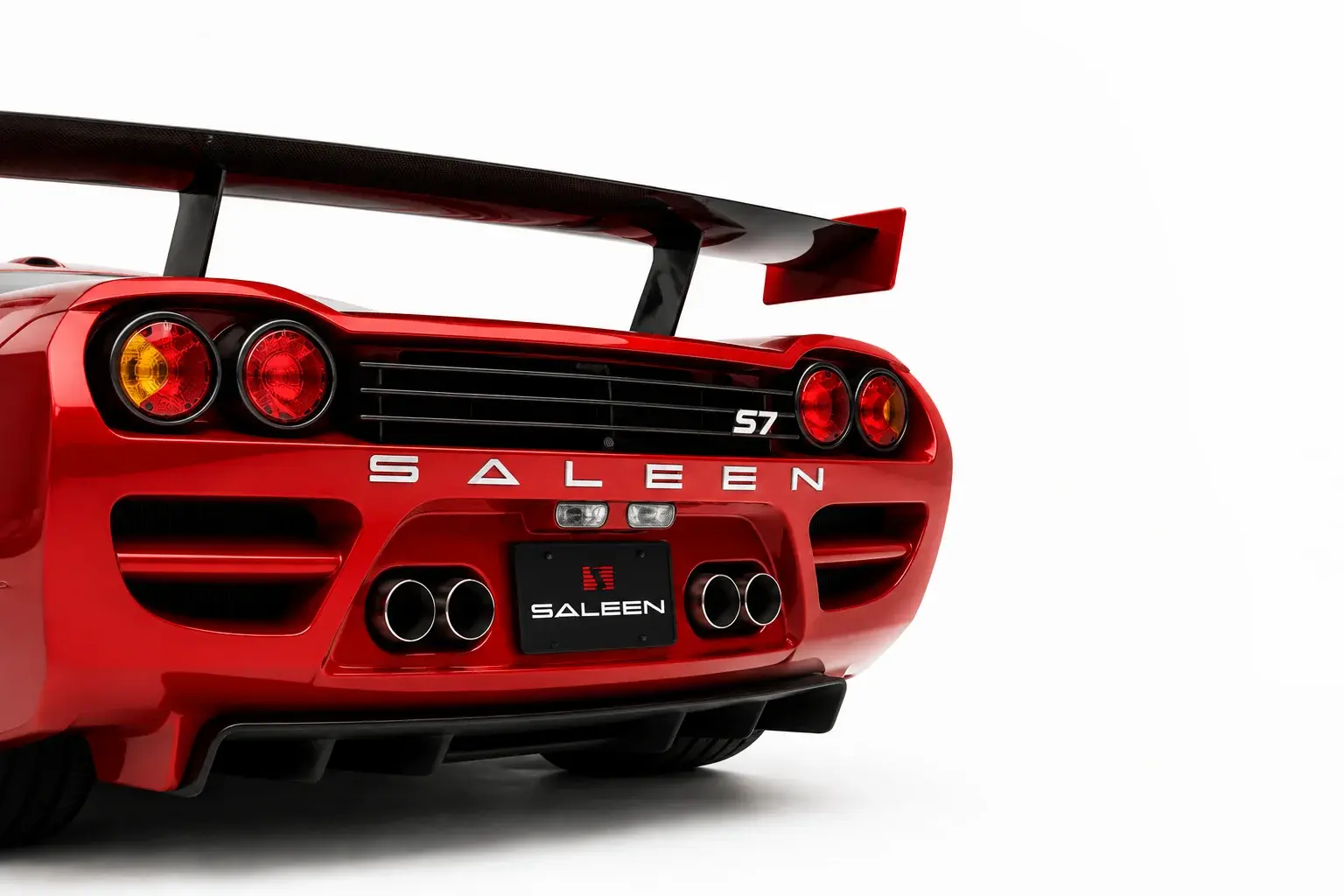 Rear view of a red Saleen S7 in a white studio