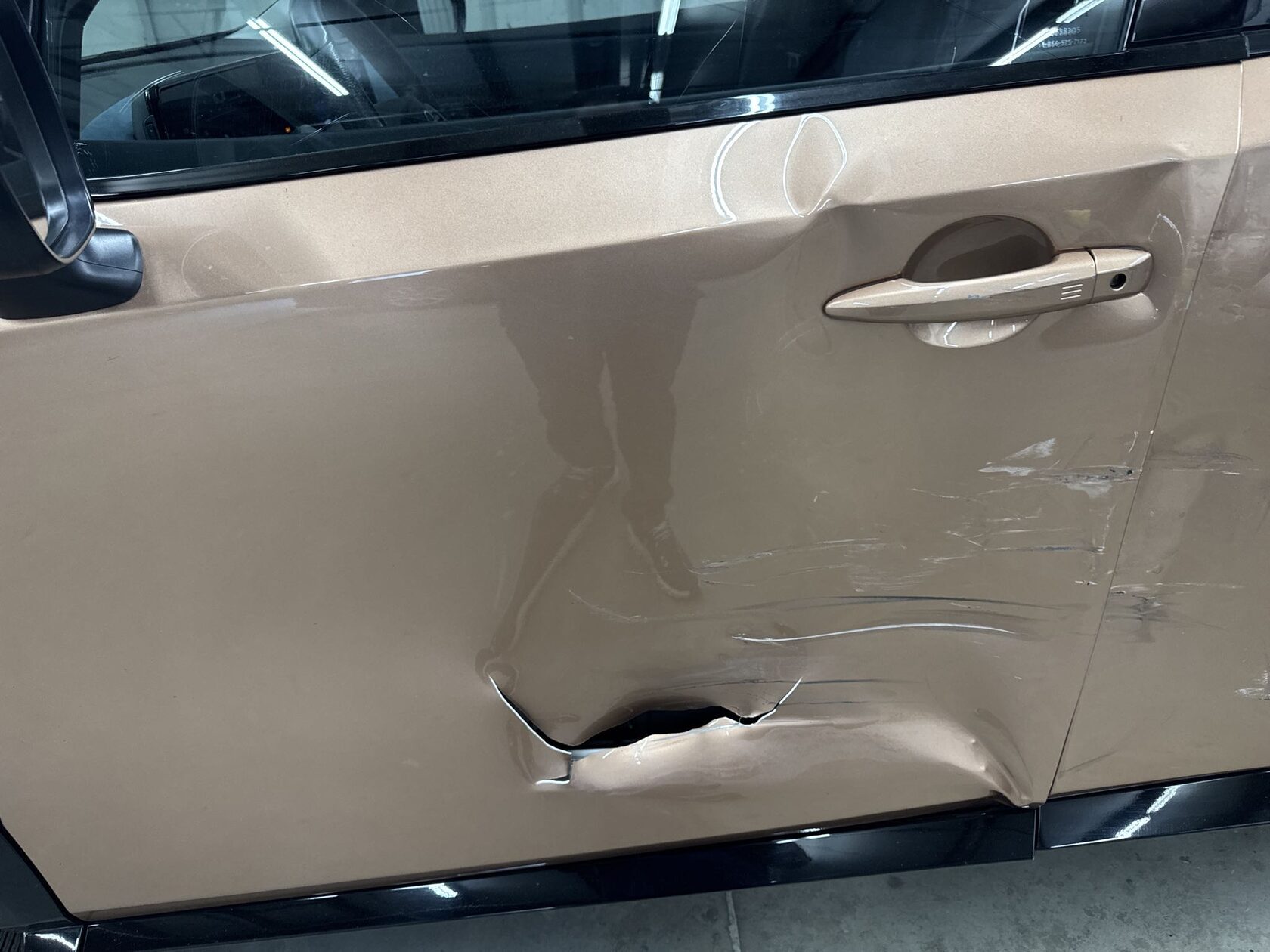 Body panel collision damage being repaired
