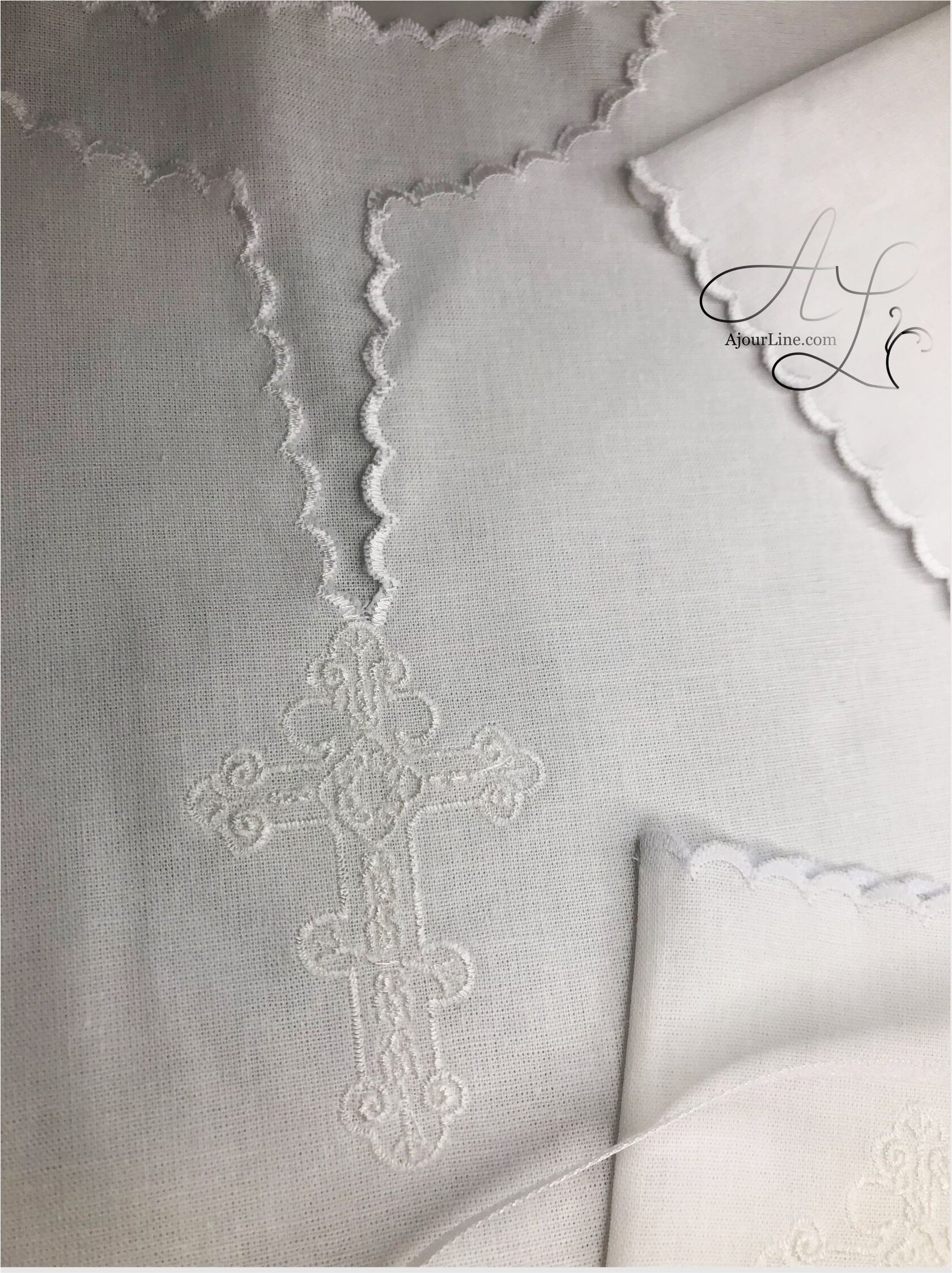 Christening set made from soft natural fabric, including a christening shirt and a hair lock pouch with embroidery, made to order in Riga, worldwide shipping.