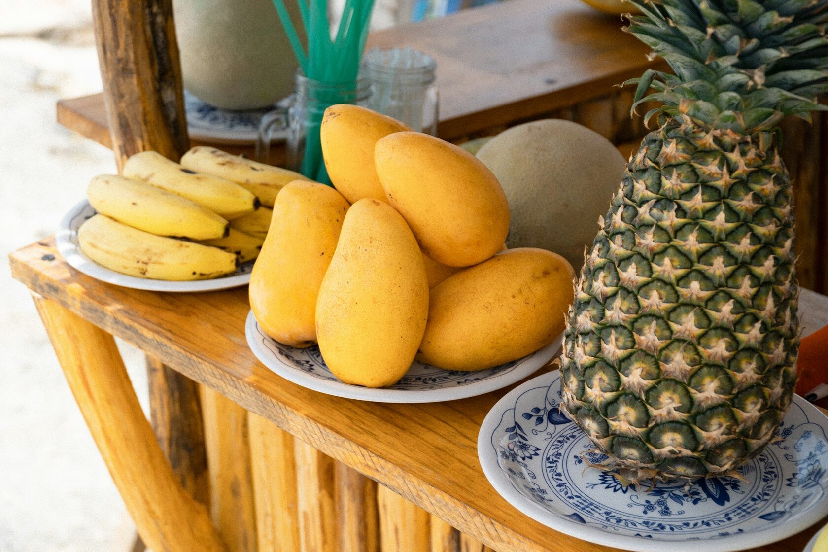 Close-up of mangoes, papaya, pineapple, and dragon fruit — fruit typical of a Mexican tropical box.