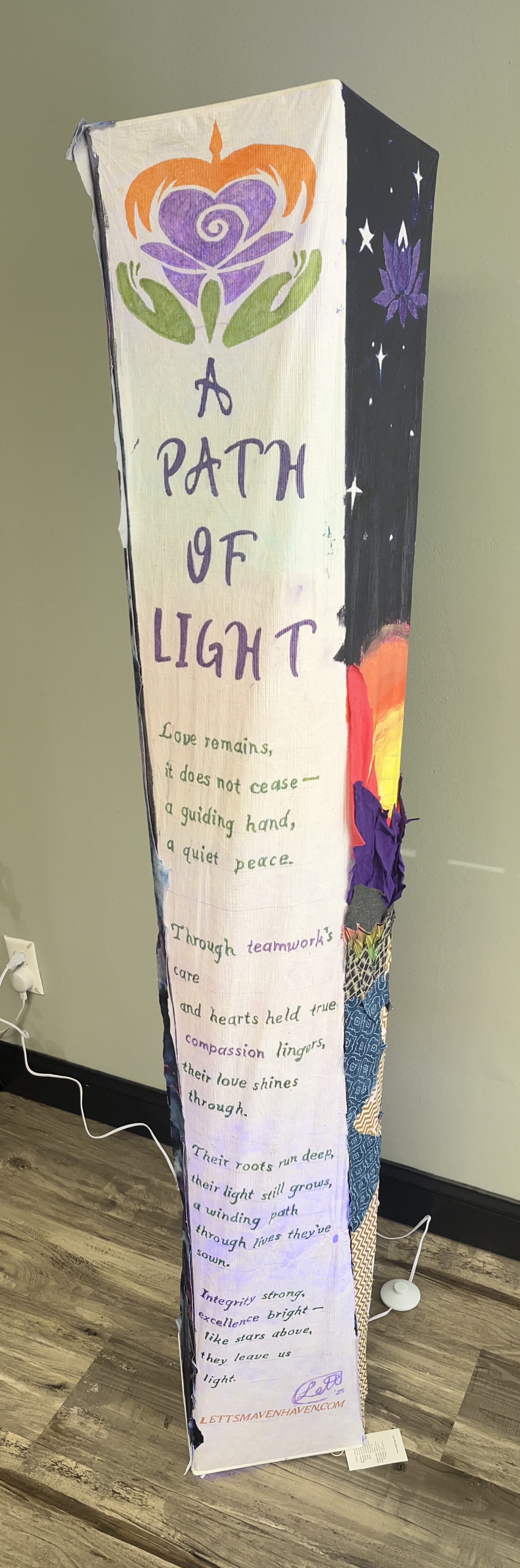 A Path of Light: complete illuminated memorial installation showing its title and poem side.