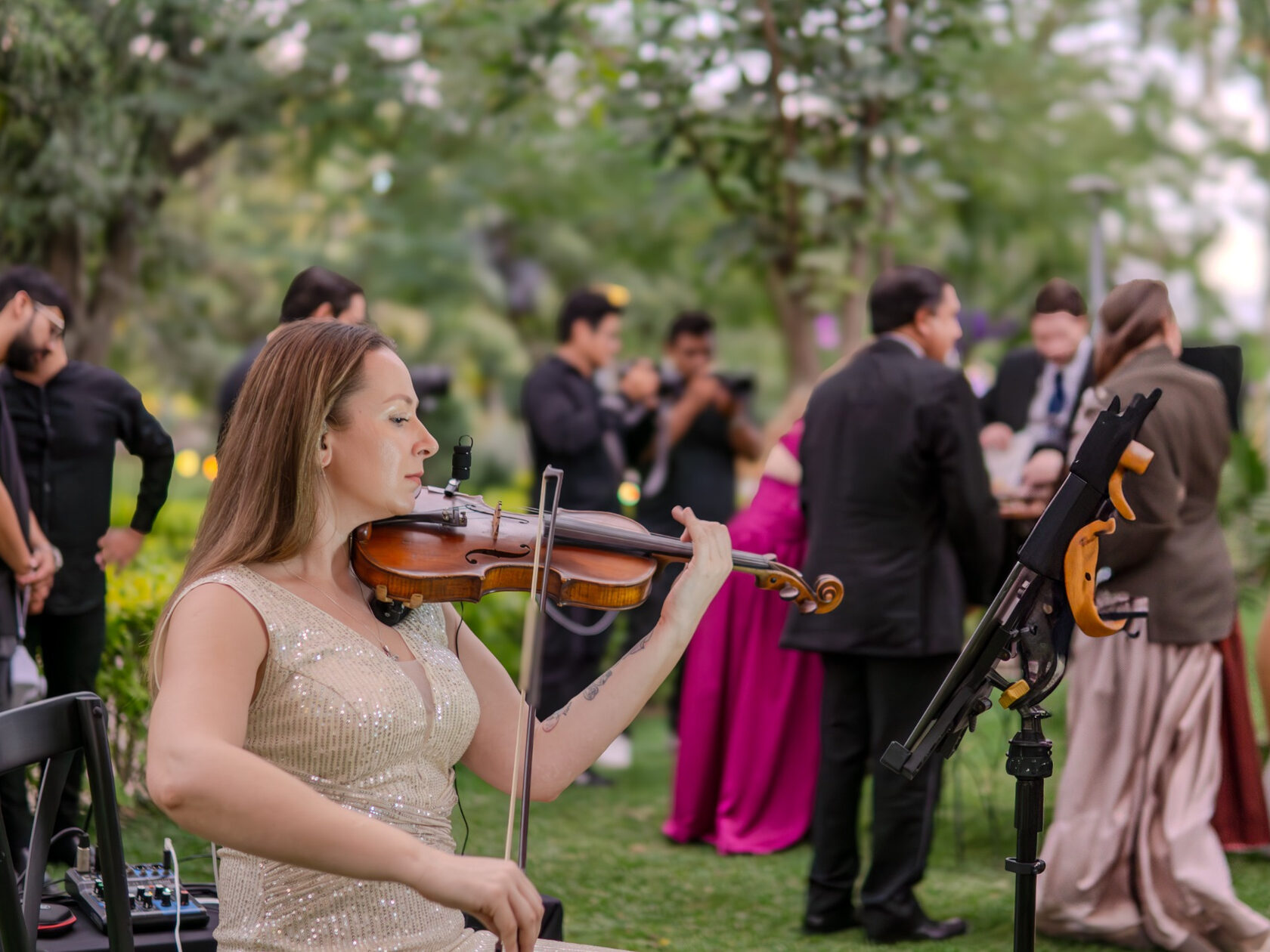 Polina performing live violin at a wedding ceremony in Mexico