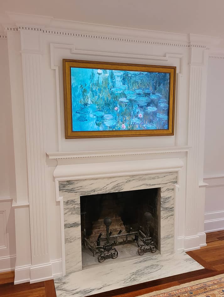 Living room fireplace mantel and historic paneling in white