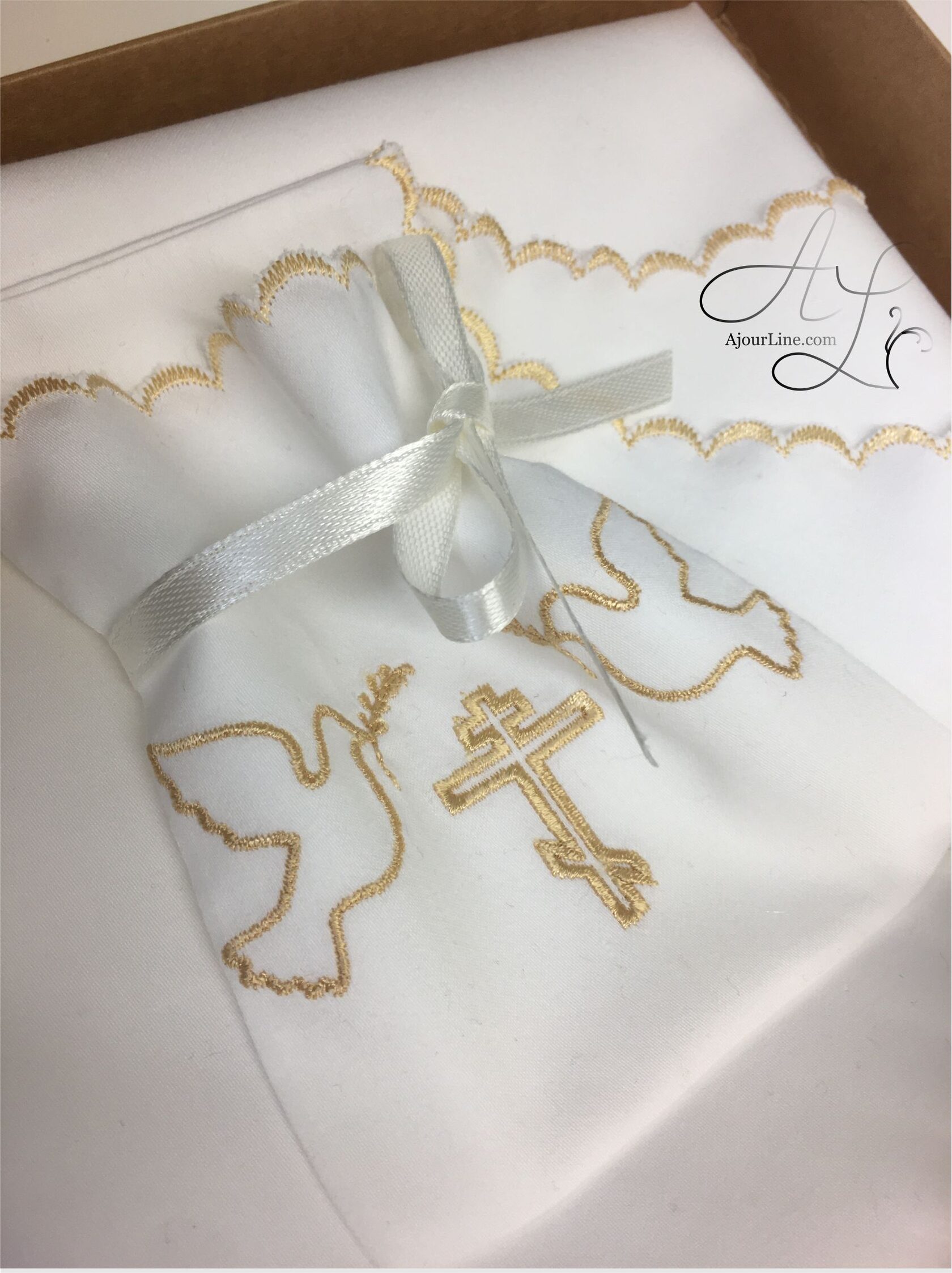 Christening set made from soft natural fabric, including a christening shirt and a hair lock pouch with embroidery, made to order in Riga, worldwide shipping.